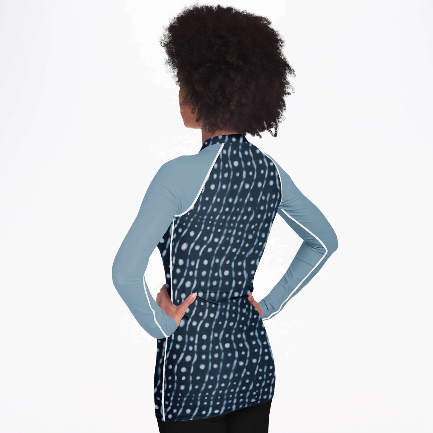 Back / side view of woman wearing whale shark rash guard