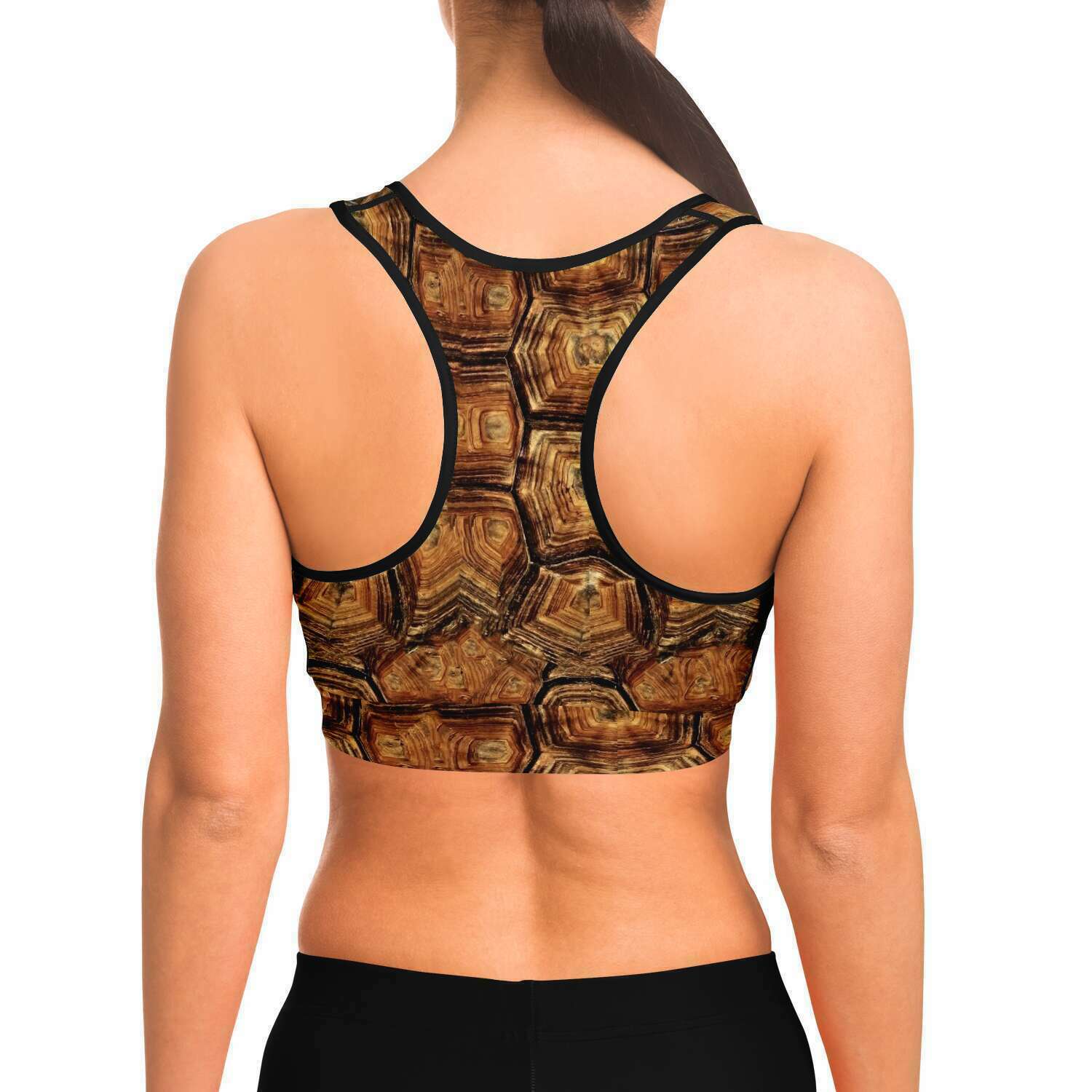 Back view of model wearing turtle racer-back crop top / sports bra for scuba diving and yoga