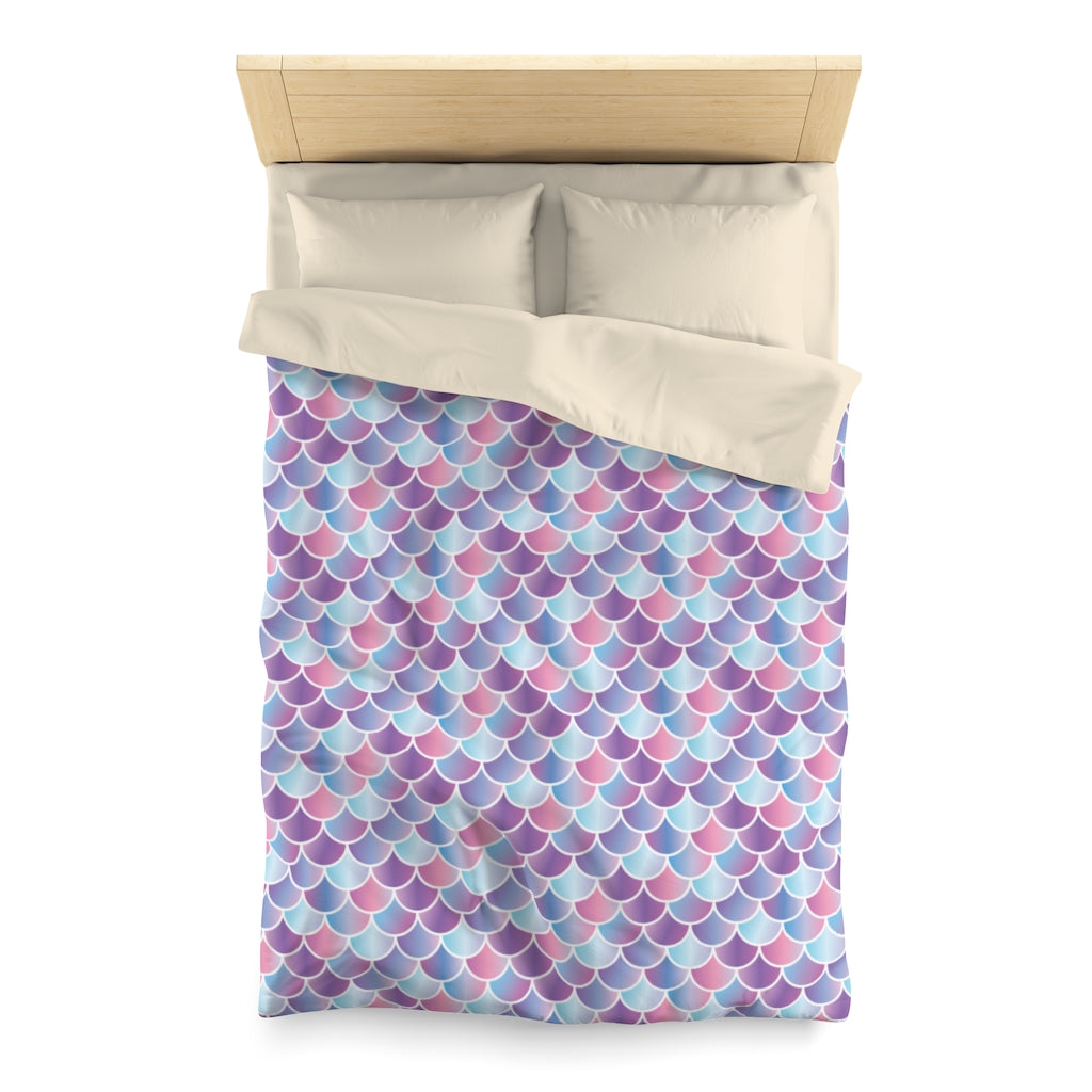 Twin sized mermaid / merman quilt / duvet / Doona cover with cream backing on a pale wooden bed
