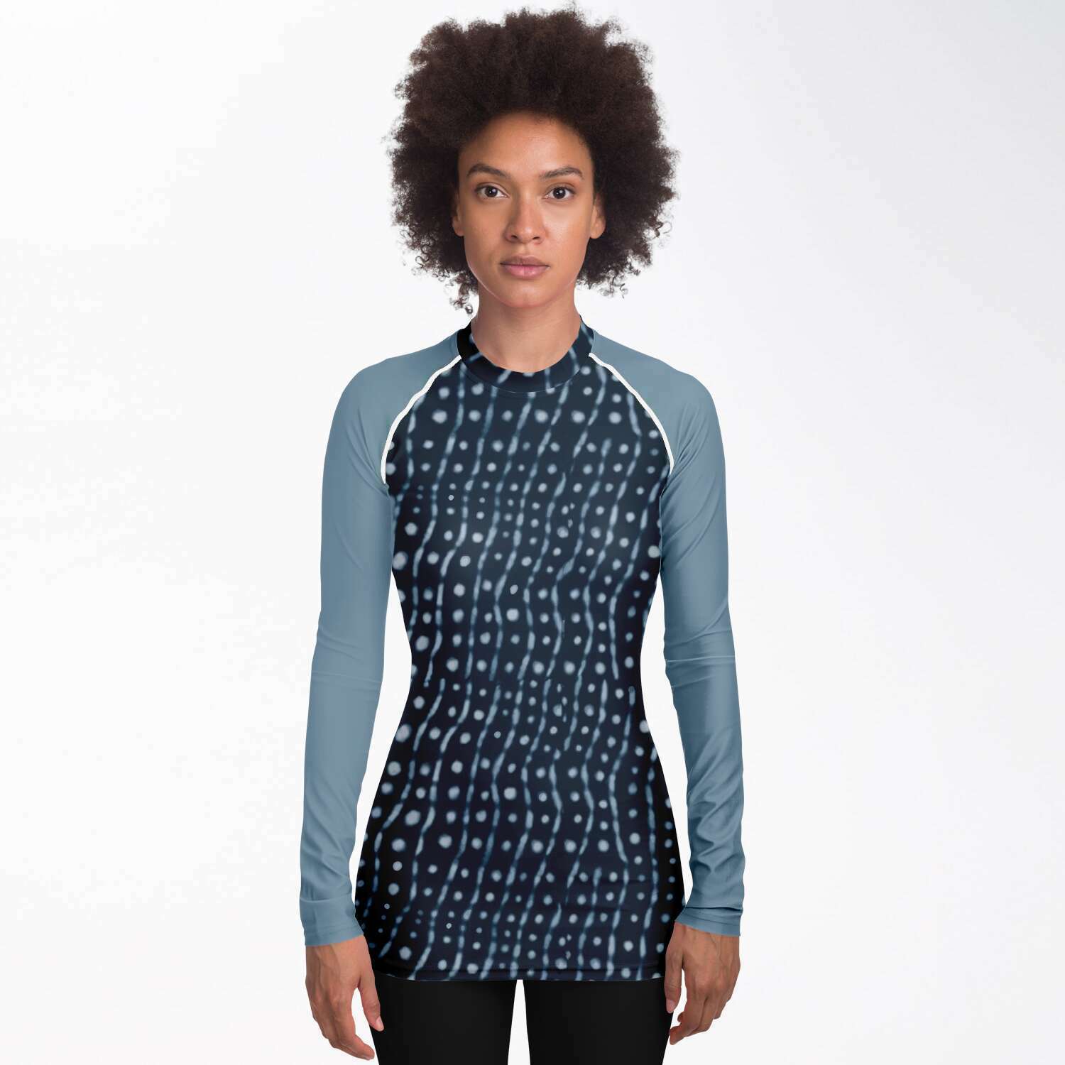 Front view of woman wearing whale shark rash guard