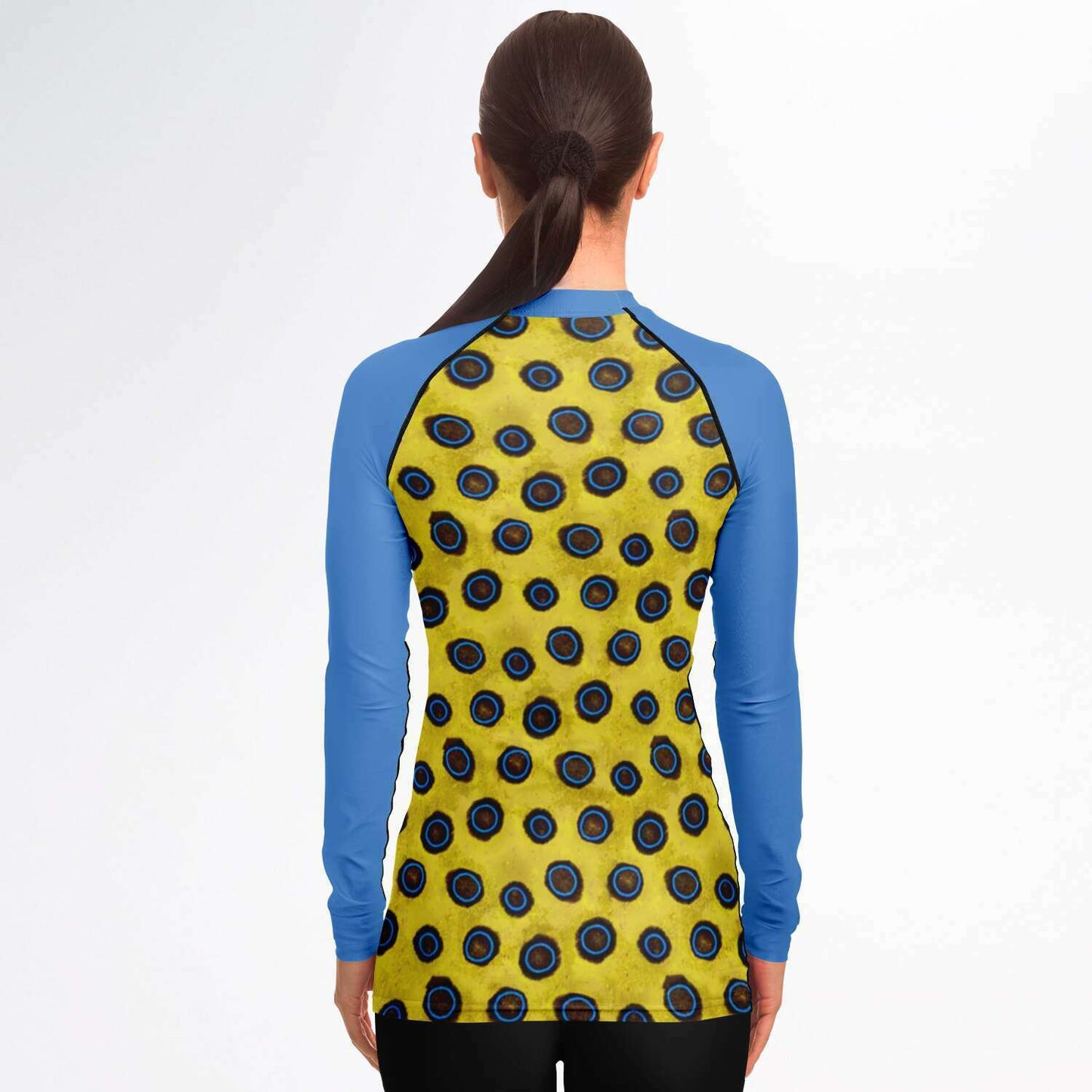 Back view of woman wearing blue-ringed octopus rash guard