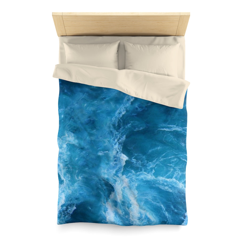 Twin sized ocean themed microfiber duvet cover with cream backing