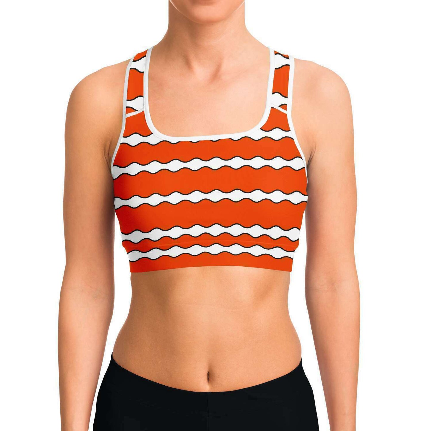 Front view of model wearing clownfish racer-back crop top / sports bra for scuba diving, yoga and mid-level intensity sports