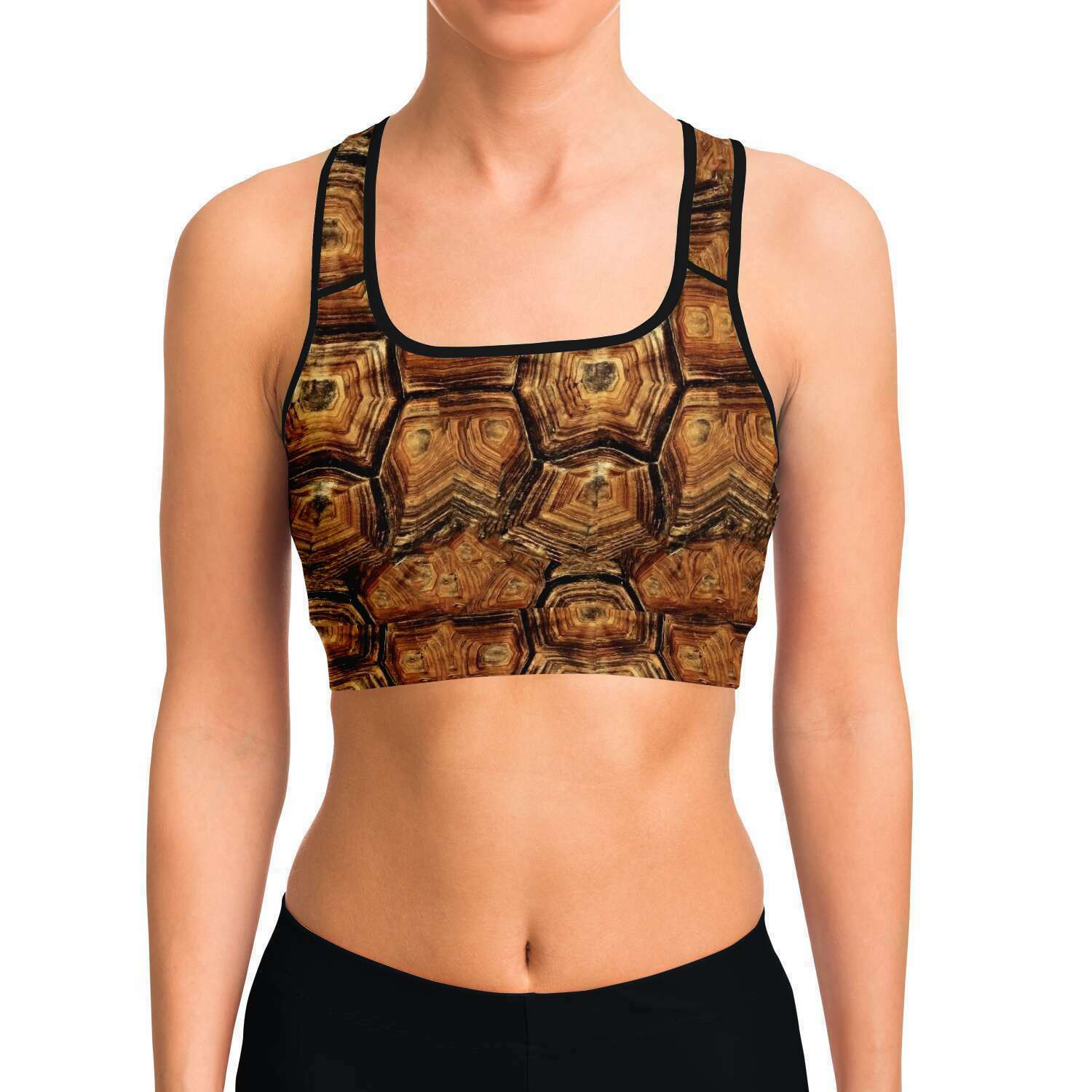 Front view of model wearing turtle racer-back crop top / sports bra