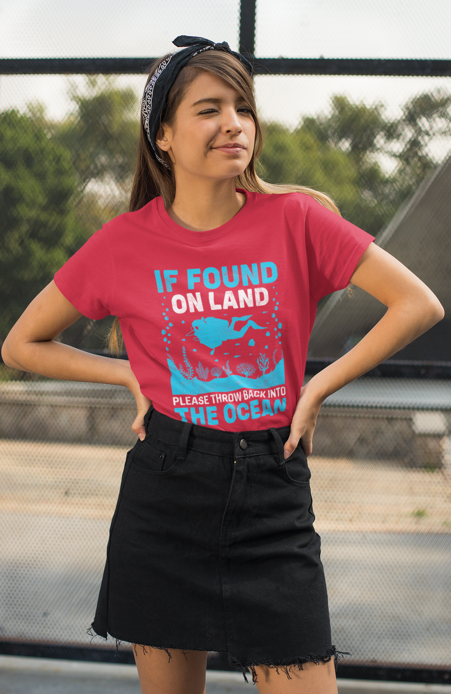 If found on land please throw back into the ocean red t-shirt worn by winking woman