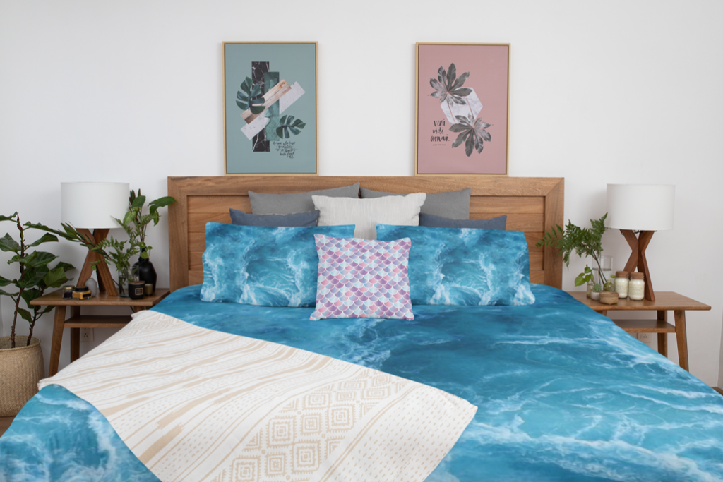 Queen sized ocean duvet on bed with matching pillow cases and a mermaid pillow case