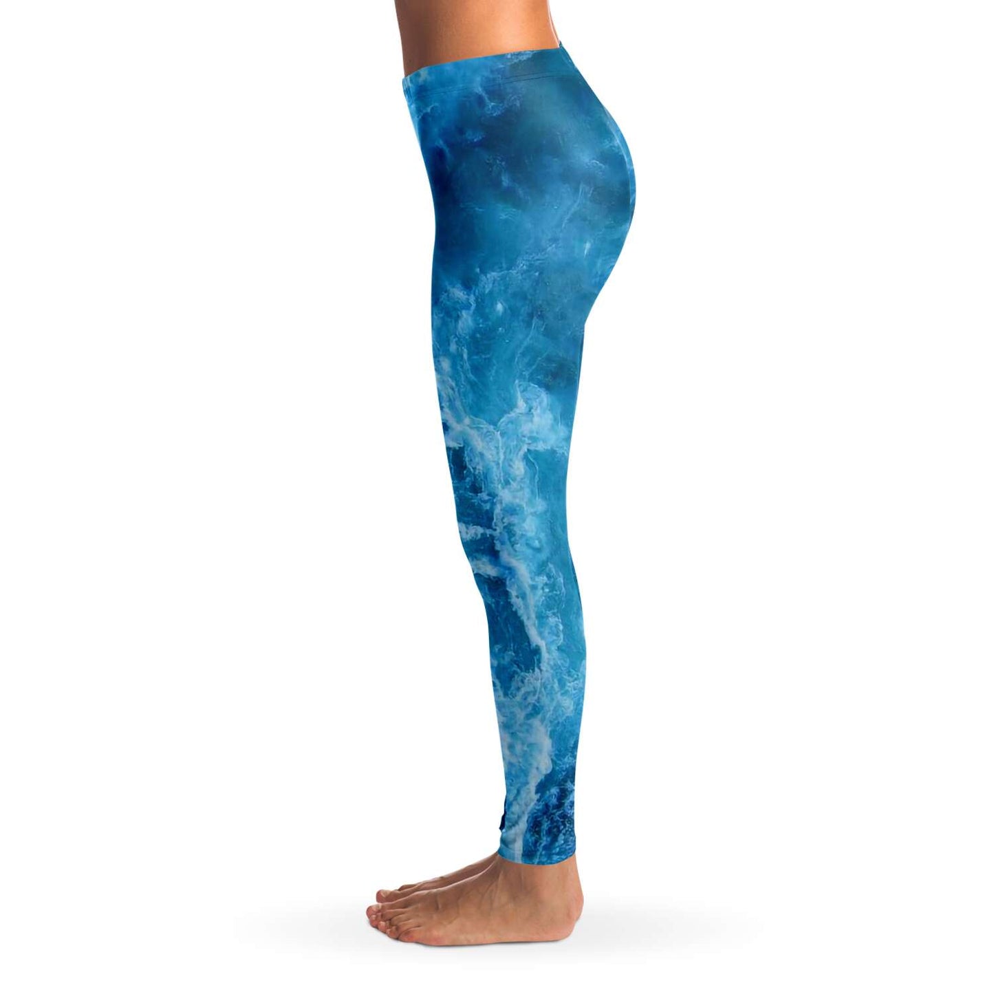Side view of ocean print scuba diving and yoga leggings with model