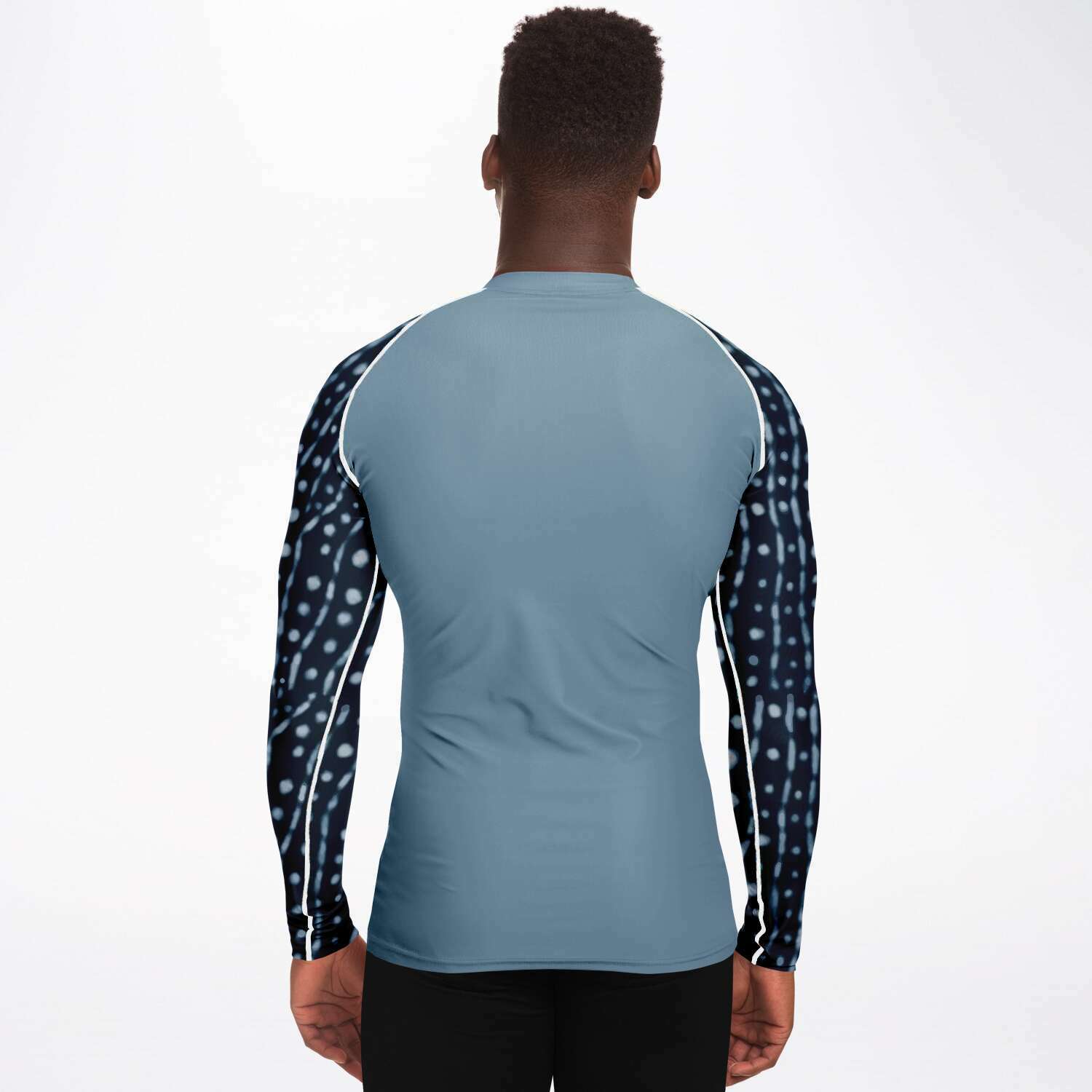 Back view of model wearing men’s whale shark rash guard
